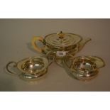 Silver three piece tea service of squat circular baluster form with gadroon edges,