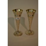 Pair of Birmingham silver plain circular tapering vases,