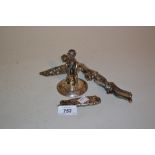 White metal male fertility statue (a/f) together with a white metal folding comb with embossed