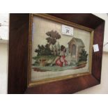Small 19th Century needlepoint picture, girl with a dog before a kennel,