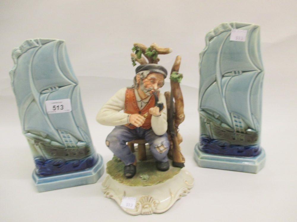 Pair of Art Deco vases in the form of ships and a Capo di Monte figure of a man smoking