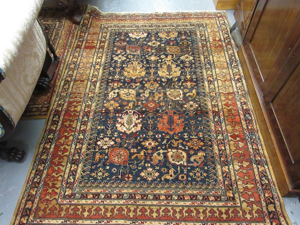 Two machine woven Persian design rugs