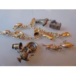 9ct Gold charm bracelet together with a quantity of various loose charms