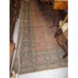 Large antique Feraghan rug having red and blue ground with all-over floral design and multiple