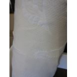 Large roll of shell motif cream fabric,