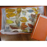 Hermes silk scarf together with a Hermes leather diary case,
