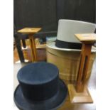 Grey top hat in a box by A.J. White Ltd., another blue top hat by Etiquette, size 6.