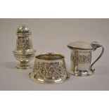 Ramsden and Carr, three piece silver condiment set embossed with clover leaves and entwined foliage,