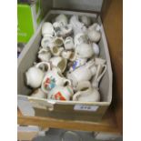 Collection of various miniature crested porcelain jugs