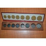 Small case containing a graduated collection of eight Roman type coins,