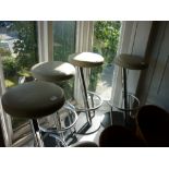 Set of four 20th Century chromium and black metal bar stools with padded seats