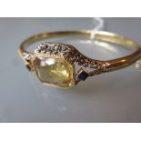 730 Yellow metal bangle set with a citrine