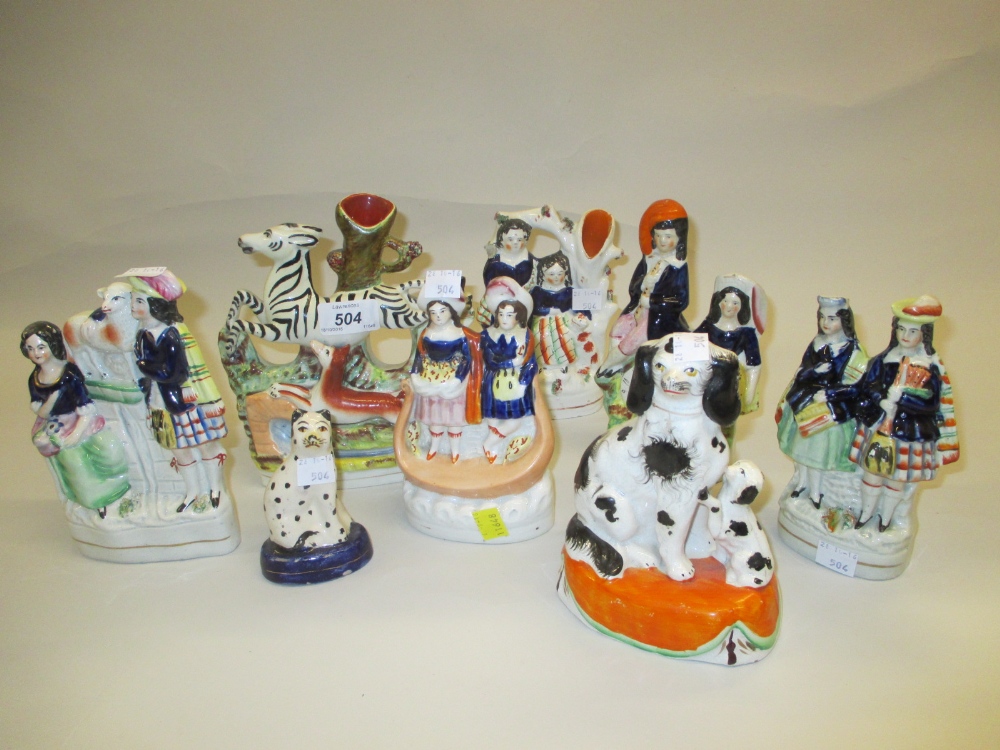 Eight various 19th Century Staffordshire figures including a zebra spill vase (a/f)