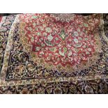 Red ground machine woven Kashan rug, 1.9m x 1.