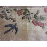 Small Chinese silk rug having bird and floral decoration