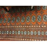 Large Pakistan rug of Bokhara design with rust ground