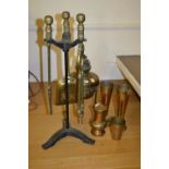 Set of three 20th Century brass fireside tools on stand,