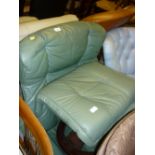 Dark green leather upholstered Stressless recliner armchair with footstool by Ekornes