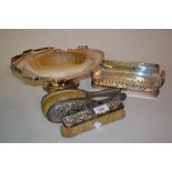 Three silver backed hairbrushes and two silver plated baskets