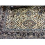 Large Indo Persian woollen carpet with all-over floral design with multiple borders on a beige