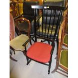 20th Century ebonised stick back rocking chair