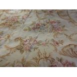 Aubusson pattern woollen wall hanging with all-over floral design on a beige ground,