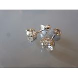 Pair of 18ct white gold diamond solitaire screw back stud earrings, approximately 2.