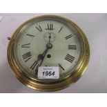 Brass and metal cased ships bulk head clock with Roman numerals,
