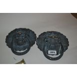 Pair of Chinese dark patinated brass mask head handles