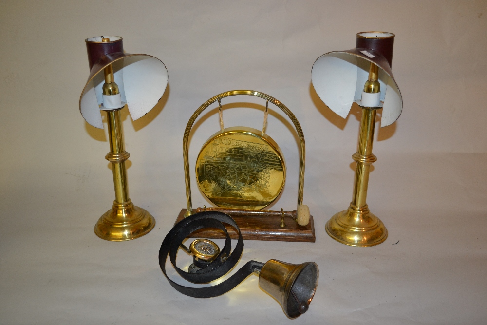 Small brass dinner gong together with a pair of late 20th Century brass candlesticks with shades