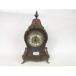 19th Century French buhl mantel clock with a gilded dial,