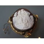 Victorian oval carved shell cameo brooch depicting ladies and swans with a yellow metal mount
