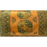 Gold ground Afghan rug having multiple gols with borders,