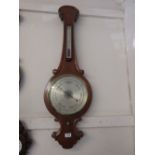 Victorian oak wheel barometer / thermometer with silvered dials