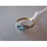 18ct Yellow gold flower head ring set with blue stone and diamond chips together with a yellow gold