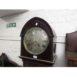 Edwardian mahogany longcase clock, the arched hood above a moulded panel door and conforming plinth,