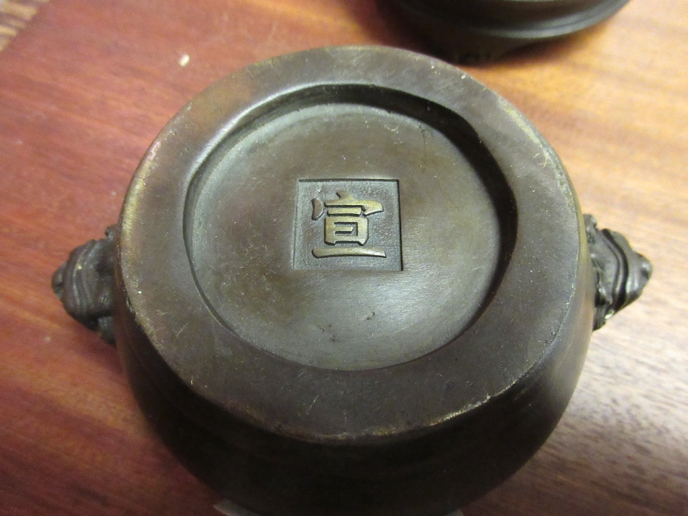 Small Chinese bronze censer with mask head side handles and seal mark to base with a stand, 4. - Image 7 of 9