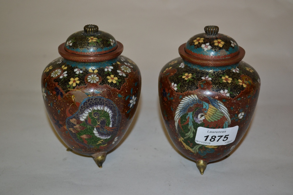 Pair of Japanese cloisonne vases and covers decorated with stylised flowers and dragons on a gold