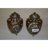 Pair of Japanese cloisonne vases and covers decorated with stylised flowers and dragons on a gold