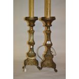 Pair of brass table lamps in the form of antique candle stands
