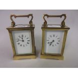 Small gilt brass cased carriage clock with enamel dial and Roman numerals together with another