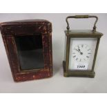 Early 20th Century brass cased carriage clock, the enamel dial with Roman numerals,