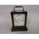 Small 19th Century French rosewood cased carriage clock with enamel dial and Roman numerals