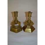 Pair of hexagonal brass candlesticks with drip trays