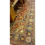 Large Belgian Persian style rug having all-over floral design with multiple borders on a red and