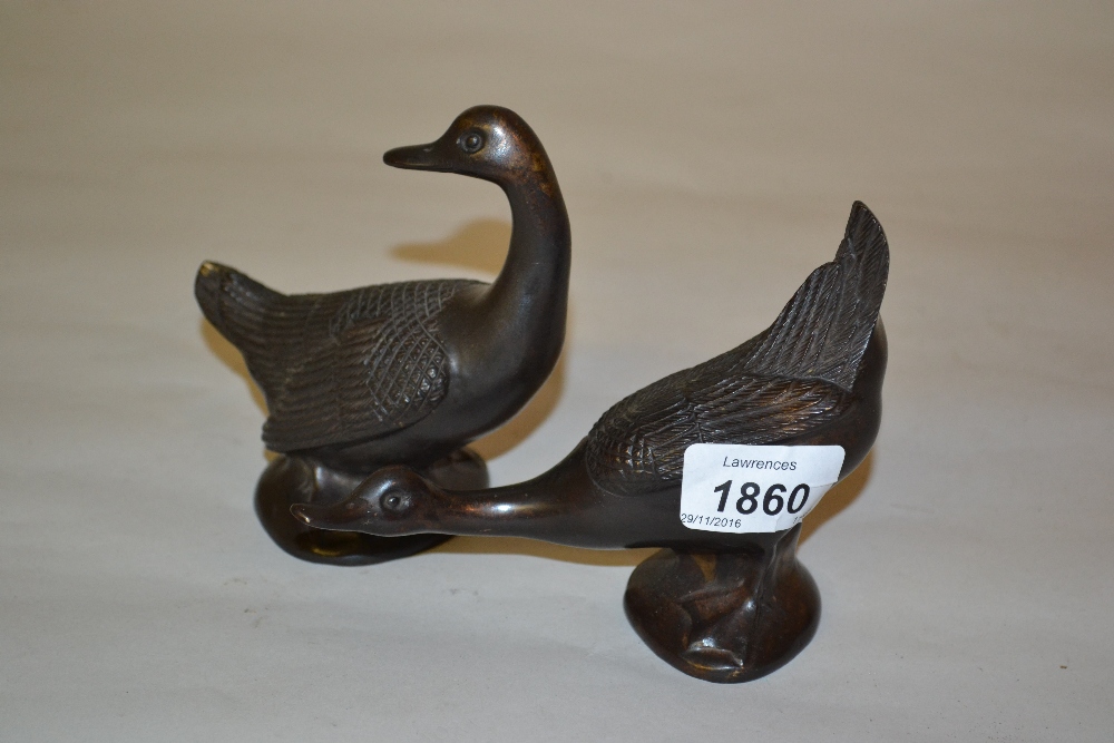 Pair of small Japanese brown patinated bronze figures of geese