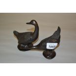 Pair of small Japanese brown patinated bronze figures of geese