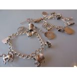 Two silver charm bracelets and a coin pendant on chain