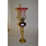 Small brass and ruby glass oil lamp with etched cranberry shade