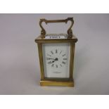 Small gilt brass cased carriage clock, the enamel dial with Roman numerals, signed Garrard and Co.